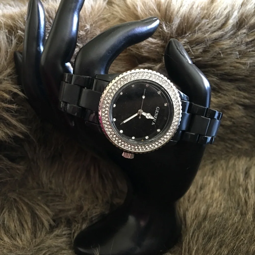 Ladies Geneva black plastic band rhinestone watch